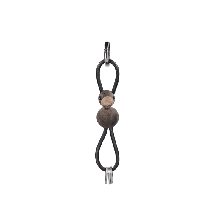 Kay Bojesen - Nyckelring i silverfärgad metall med fågel och svart läder i rökt ek